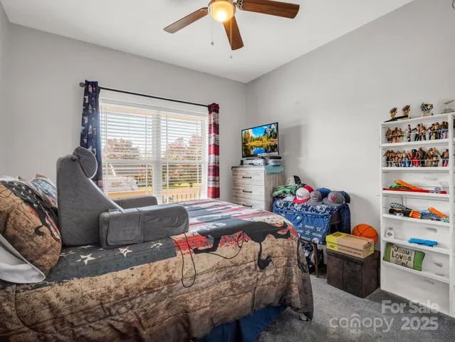 a bedroom with bed and window