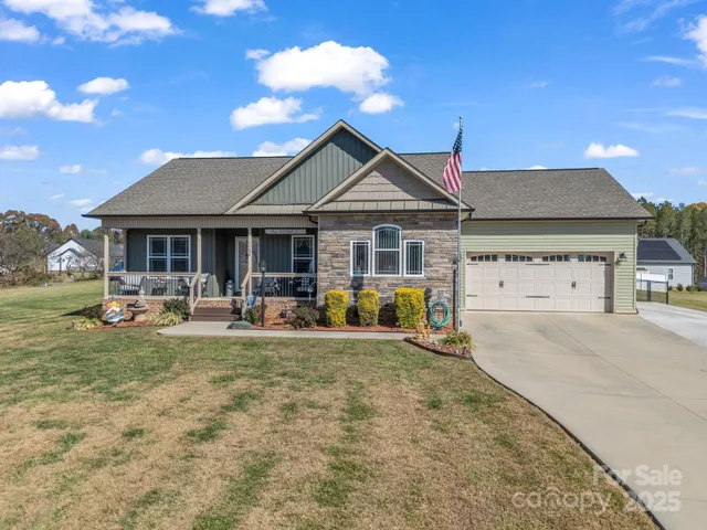 a view of a house with backyard porch and sitting area