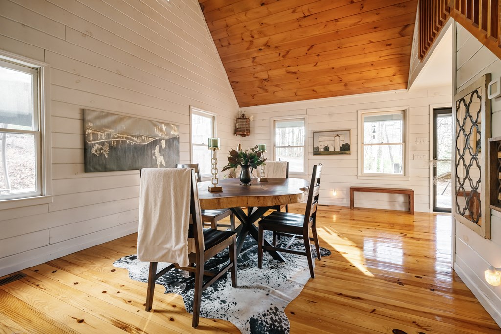 31 Highland Hammock Drive Blue Ridge, GA 30513 - Photo 12 of 67 a view of a dining room with furniture and wooden floor