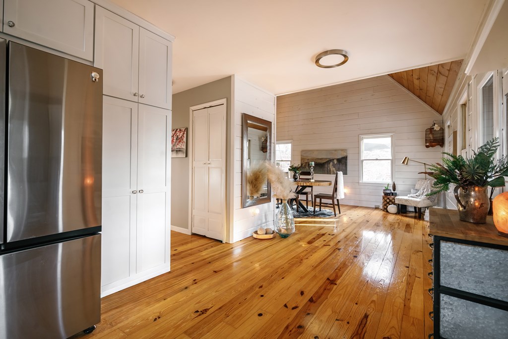 31 Highland Hammock Drive Blue Ridge, GA 30513 - Photo 17 of 67 a living room with stainless steel appliances furniture a refrigerator and a table