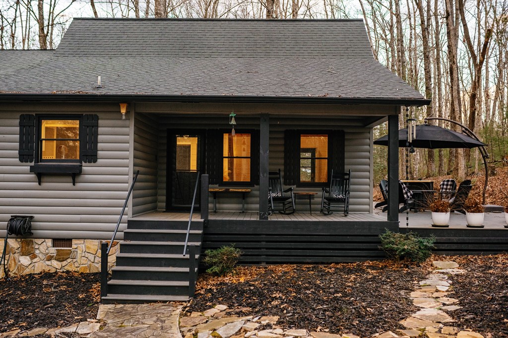 31 Highland Hammock Drive Blue Ridge, GA 30513 - Photo 2 of 67 a front view of a house with porch and a yard