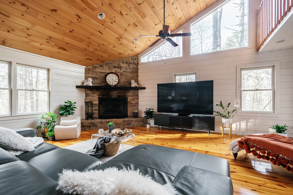 31 Highland Hammock Drive Blue Ridge, GA 30513 - Photo 29 of 67 a living room with furniture and a flat screen tv