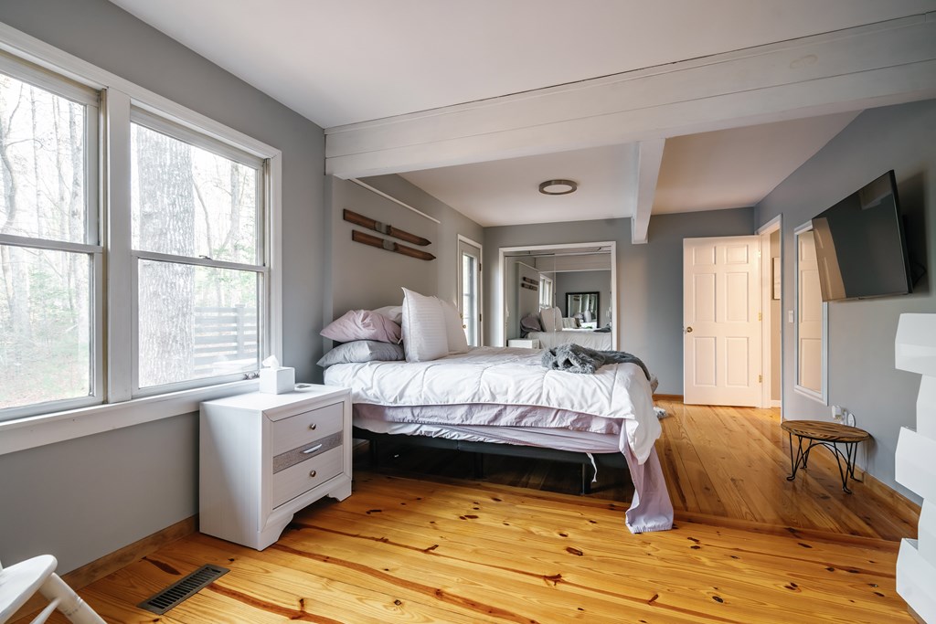 31 Highland Hammock Drive Blue Ridge, GA 30513 - Photo 34 of 67 a bed sitting in a bedroom next to a window