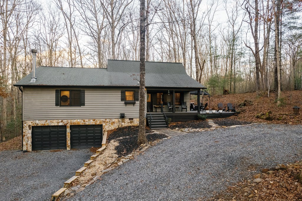 31 Highland Hammock Drive Blue Ridge, GA 30513 - Photo 4 of 67 a front view of a house with garden