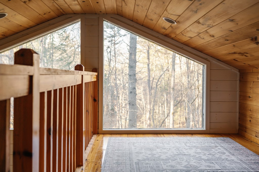31 Highland Hammock Drive Blue Ridge, GA 30513 - Photo 53 of 67 a view of empty room with wooden floor and fan