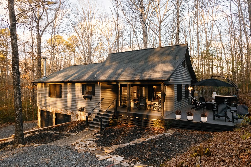31 Highland Hammock Drive Blue Ridge, GA 30513 - Photo 57 of 67 a front view of a house with garden