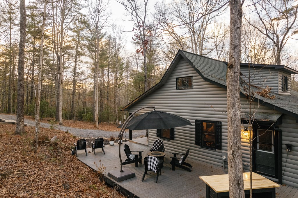31 Highland Hammock Drive Blue Ridge, GA 30513 - Photo 66 of 67 a view of house with backyard and sitting area