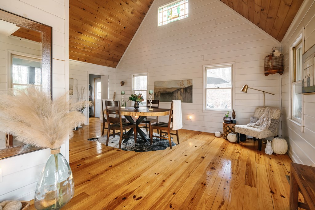 31 Highland Hammock Drive Blue Ridge, GA 30513 - Photo 7 of 67 a living room filled with furniture and a chandelier