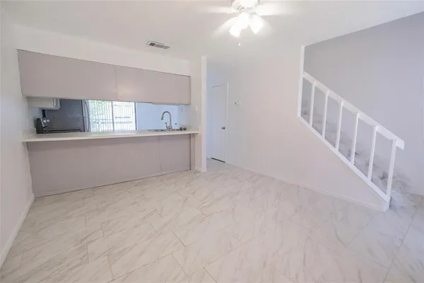a view of a kitchen with a sink cabinets and a window
