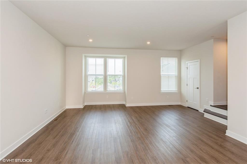 4806 Spruce Road Gibsonia, PA 15044 - Photo 13 of 49 an empty room with wooden floor and windows