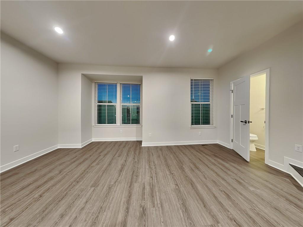 4806 Spruce Road Gibsonia, PA 15044 - Photo 14 of 49 an empty room with wooden floor and windows
