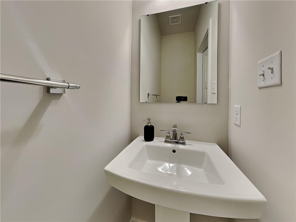 4806 Spruce Road Gibsonia, PA 15044 - Photo 15 of 49 a bathroom with a sink and a mirror