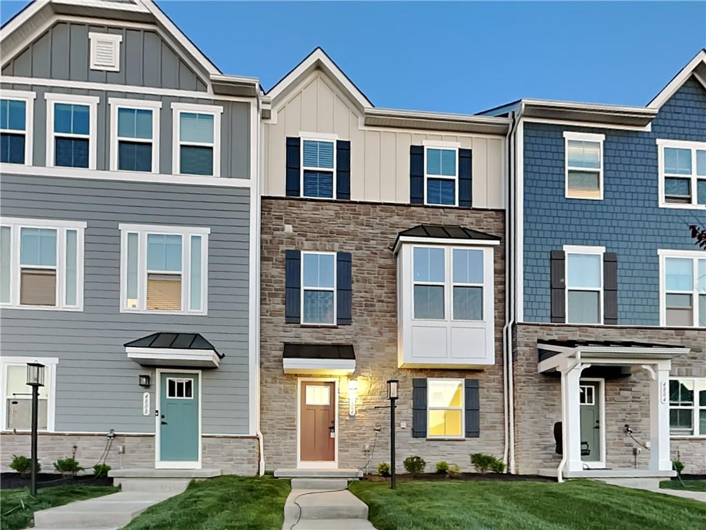 4806 Spruce Road Gibsonia, PA 15044 - Photo 2 of 49 a front view of a residential apartment building with a yard