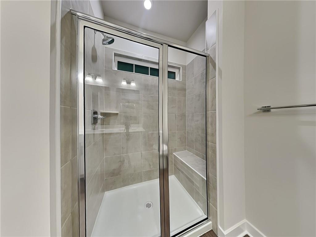 4806 Spruce Road Gibsonia, PA 15044 - Photo 21 of 49 a bathroom with a glass shower door