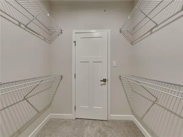 a view of a hallway with staircase