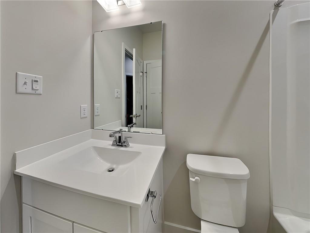 4806 Spruce Road Gibsonia, PA 15044 - Photo 32 of 49 a bathroom with a toilet sink and mirror