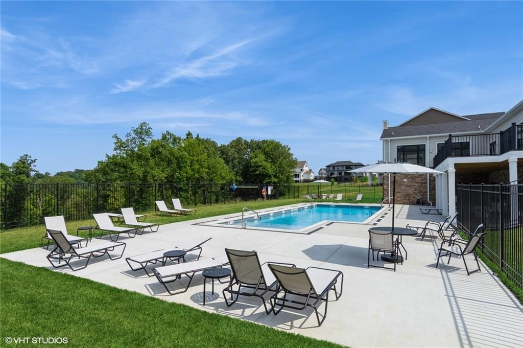 4806 Spruce Road Gibsonia, PA 15044 - Photo 46 of 49 a view of a patio with table and chairs with wooden fence