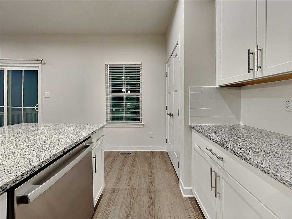 4806 Spruce Road Gibsonia, PA 15044 - Photo 7 of 49 a kitchen with granite countertop wooden cabinets and a granite counter tops