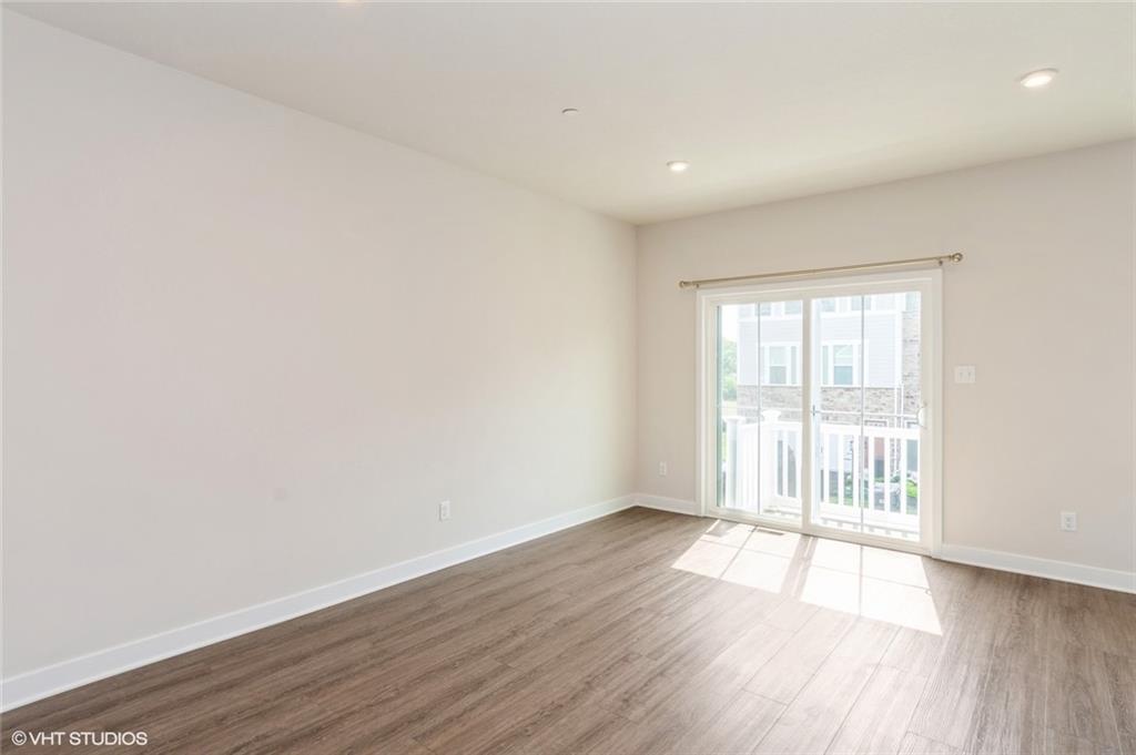 4806 Spruce Road Gibsonia, PA 15044 - Photo 9 of 49 an empty room with wooden floor and windows