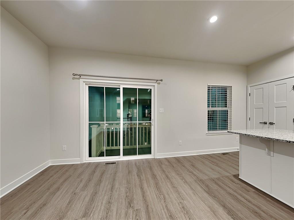 4806 Spruce Road Gibsonia, PA 15044 - Photo 10 of 49 a view of an empty room with wooden floor and windows