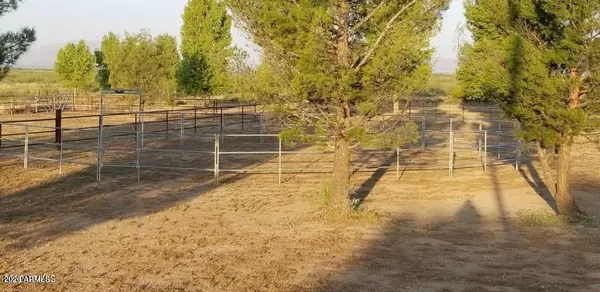 a view of a lake with a yard