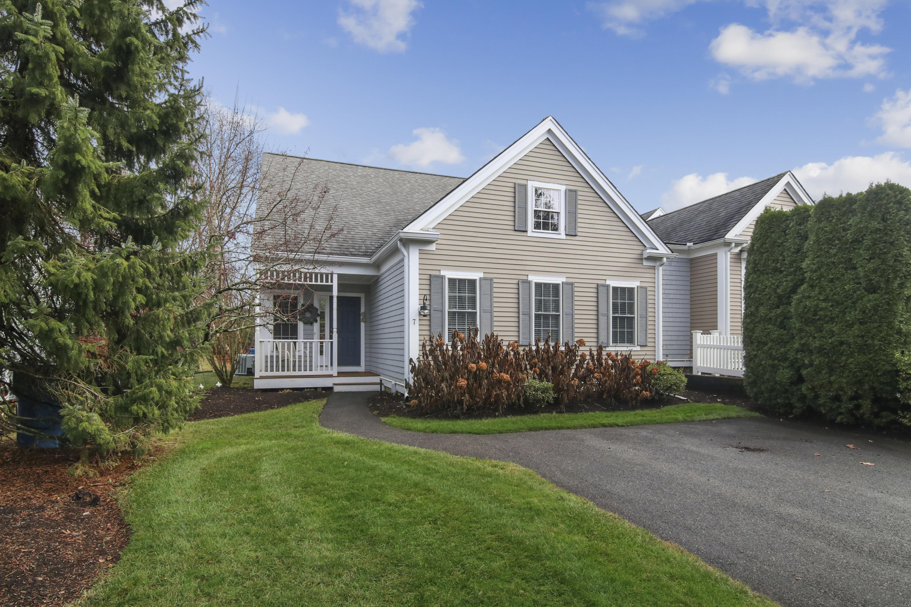 a front view of a house with garden