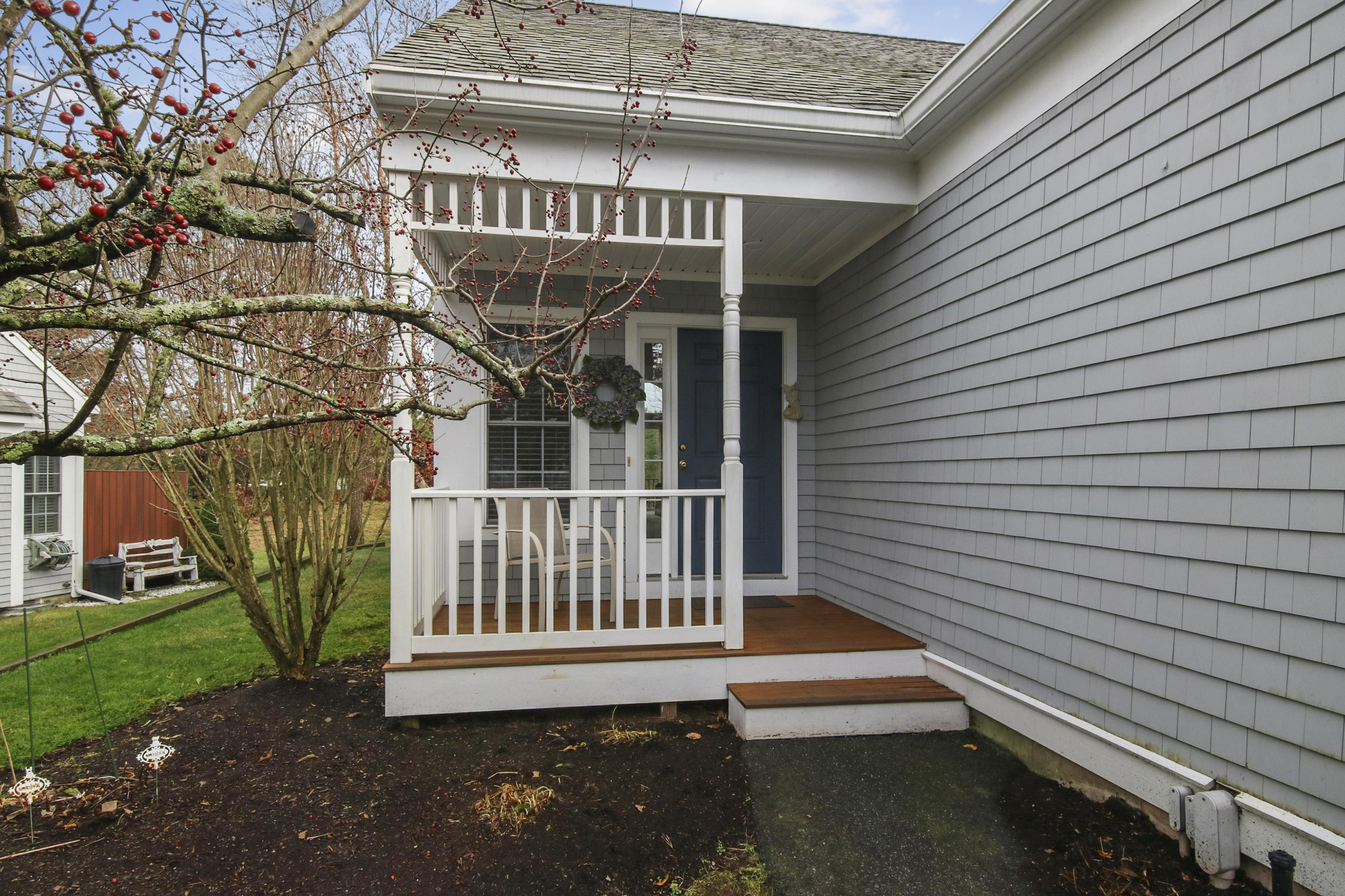 7 Prestwick Road Bourne, MA 02532 - Photo 3 of 19 a view of a house with a small yard and wooden floor and fence