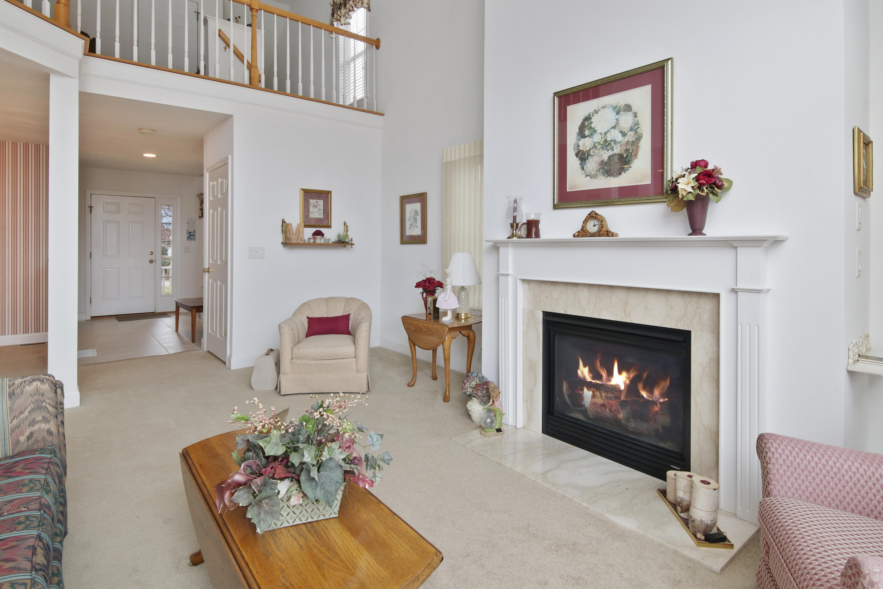 7 Prestwick Road Bourne, MA 02532 - Photo 7 of 19 a living room with furniture and a fireplace