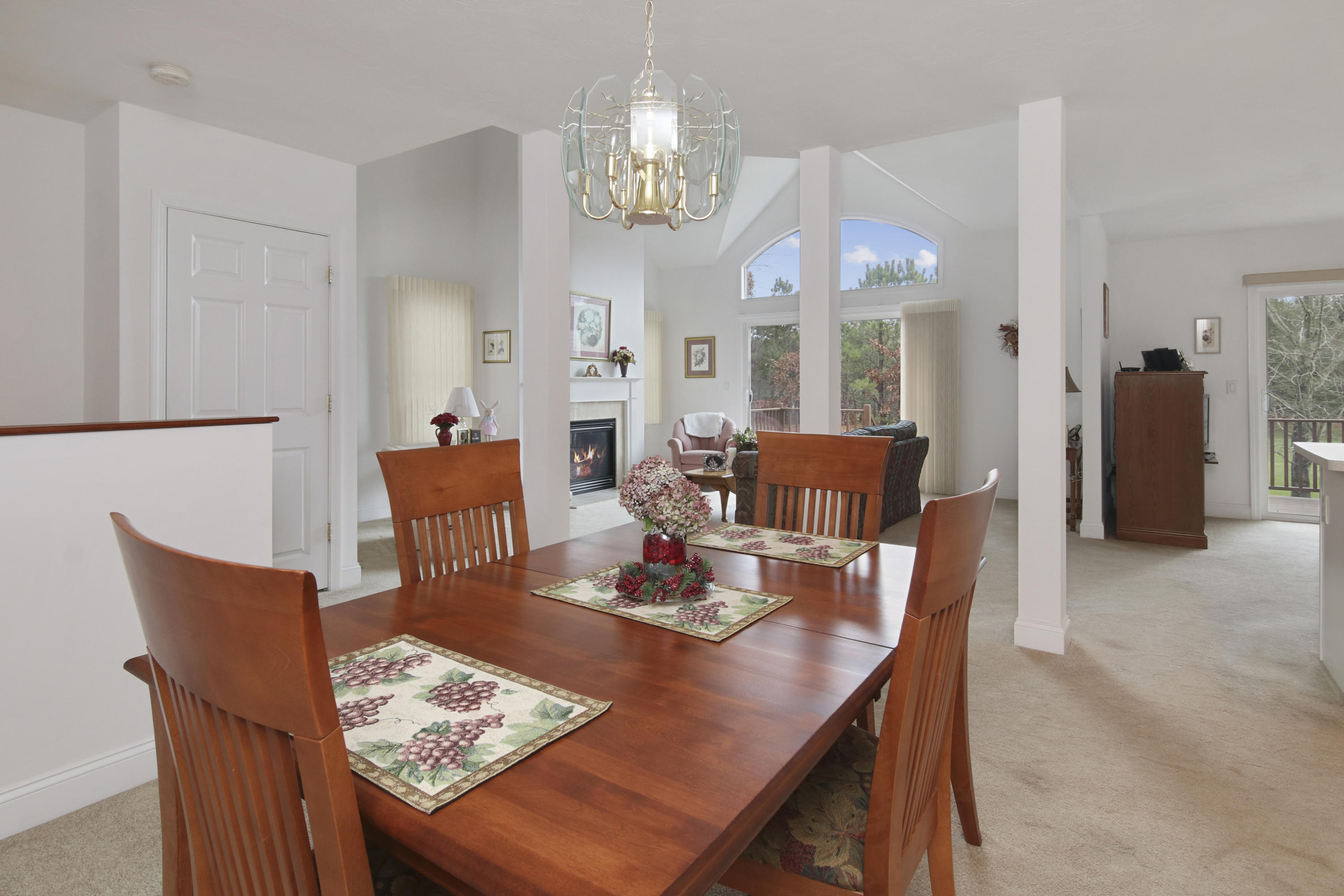 7 Prestwick Road Bourne, MA 02532 - Photo 8 of 19 a view of a dining room with furniture a chandelier and wooden floor