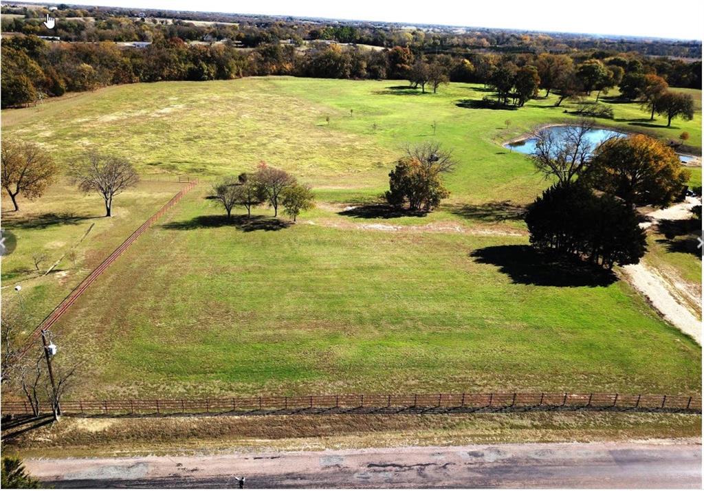 2000 North Lincoln Park Road Van Alstyne, TX 75495 - Photo 5 of 5 a view of a lake with a big yard
