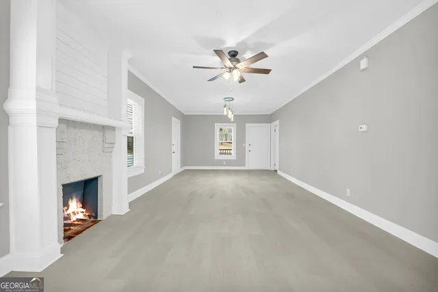 a living room with a fireplace and a window