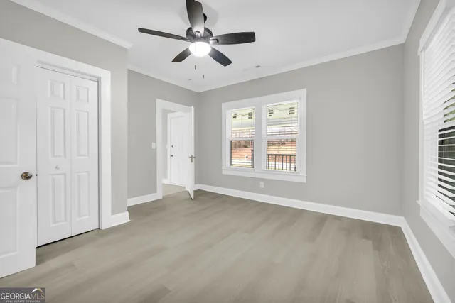 a view of an empty room with a window