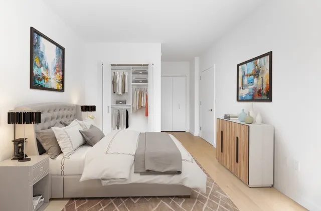 a bedroom with a bed and a couch