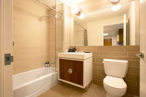 a bathroom with a sink toilet and shower