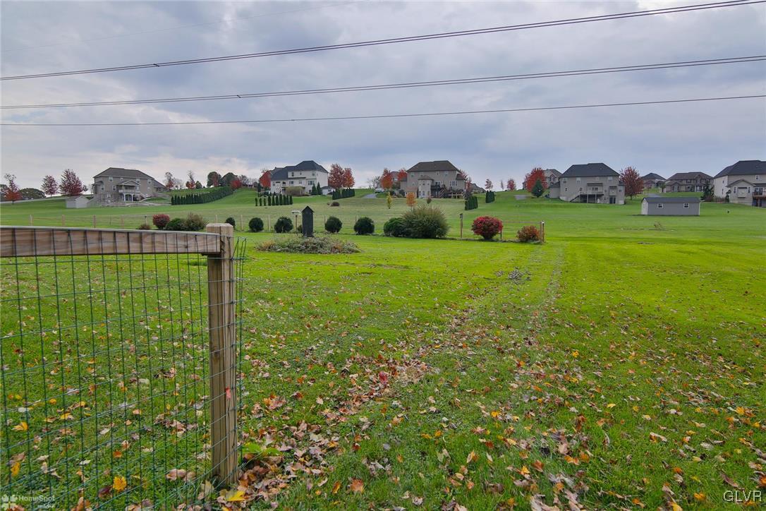 653 East Dell Road Bath, PA 18014 - Photo 8 of 35 a view of a garden with a building in the background