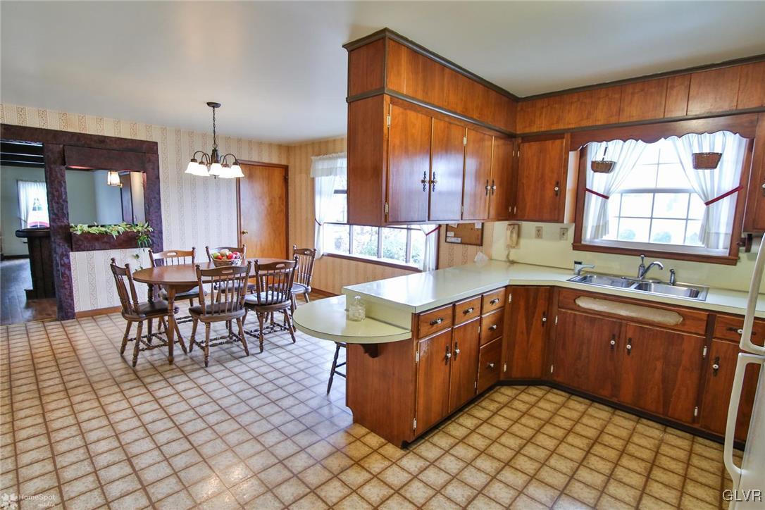 653 East Dell Road Bath, PA 18014 - Photo 9 of 35 a kitchen with a sink table and chairs
