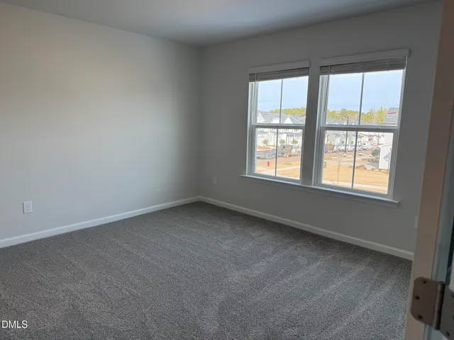 a view of a house with a iron gate
