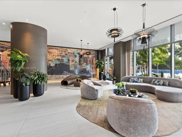 a view of a living room and patio furniture