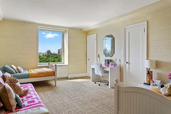a bedroom with a bed and furniture