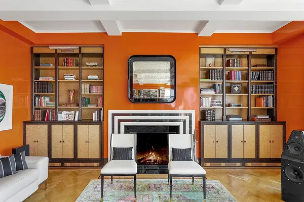 a living room with furniture a rug and a large window