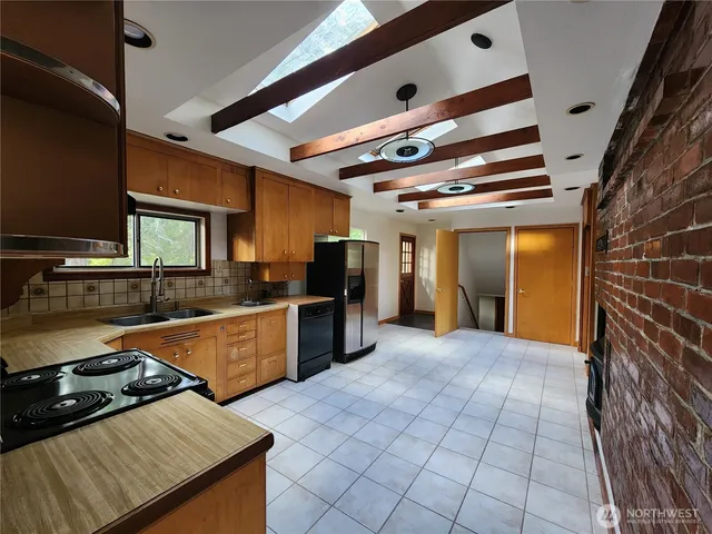 an empty room with a empty space and windows