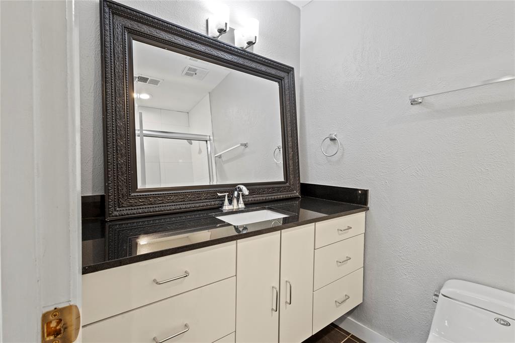 4371 Madera Road, Unit 4 Irving, TX 75038 - Photo 11 of 23 Bathroom with oversized vanity and toilet