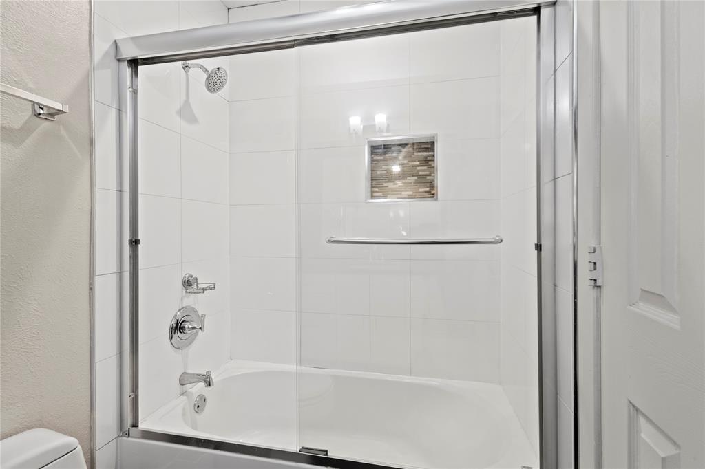 4371 Madera Road, Unit 4 Irving, TX 75038 - Photo 12 of 23 Bathroom with enclosed tub / shower combo and toilet