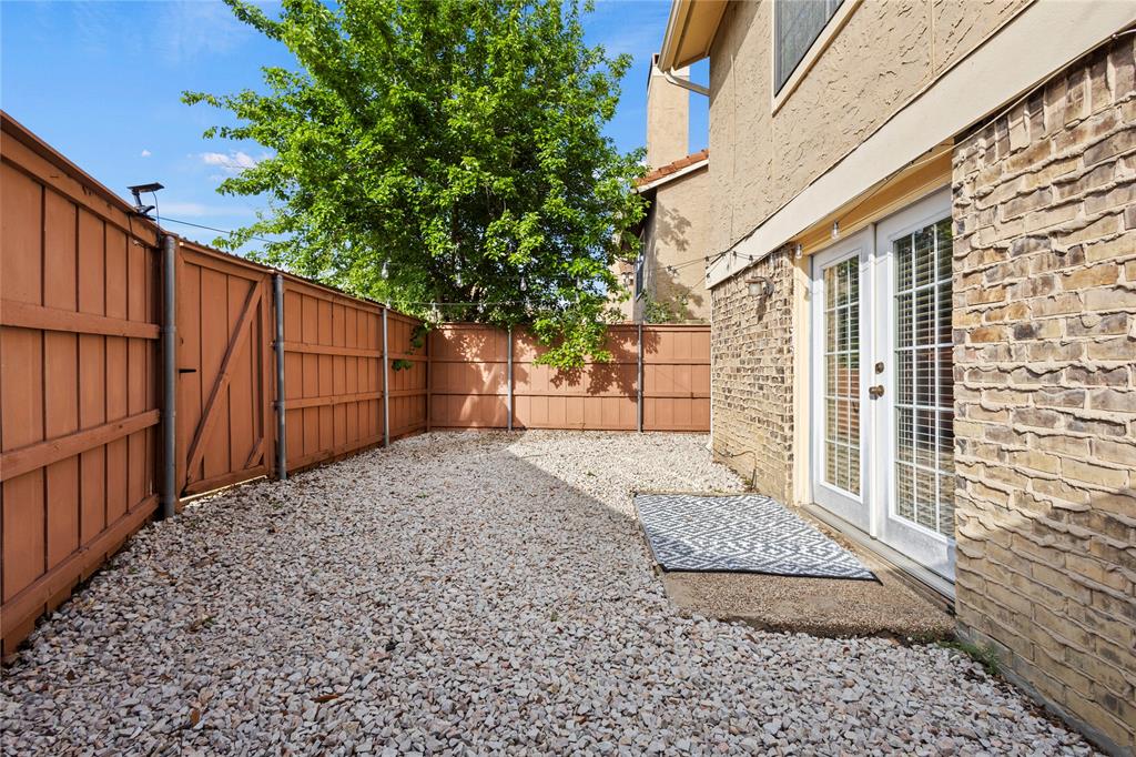 4371 Madera Road, Unit 4 Irving, TX 75038 - Photo 22 of 23 View of yard with french doors