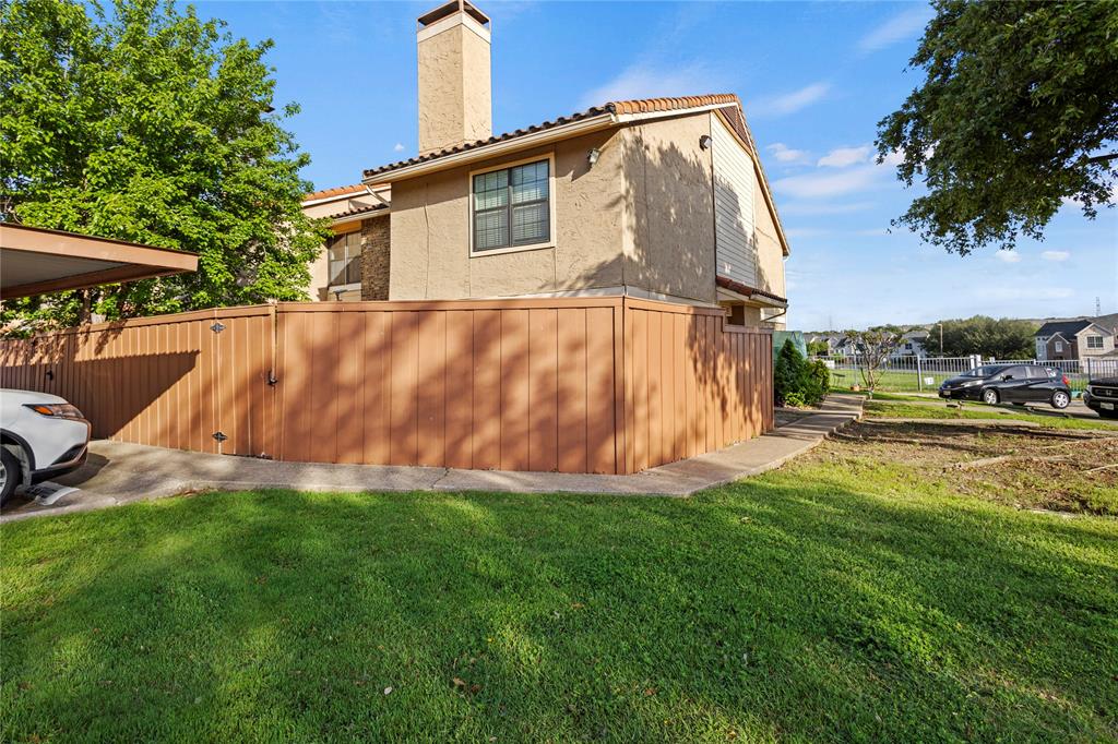 4371 Madera Road, Unit 4 Irving, TX 75038 - Photo 3 of 23 View of side of home with a yard
