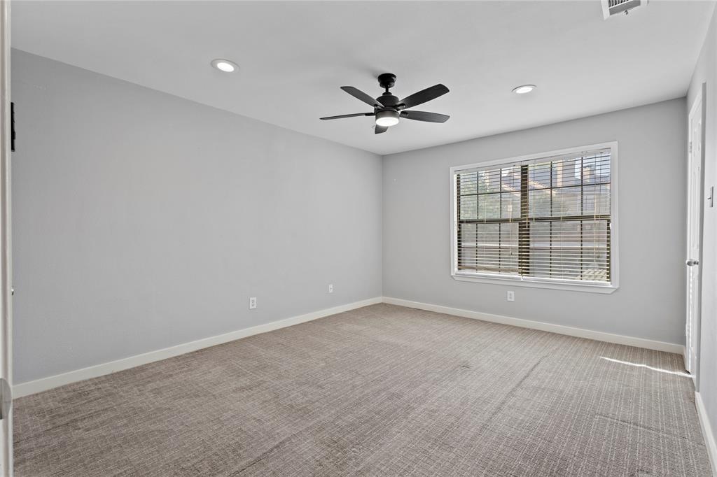 4371 Madera Road, Unit 4 Irving, TX 75038 - Photo 5 of 23 Carpeted spare room with ceiling fan