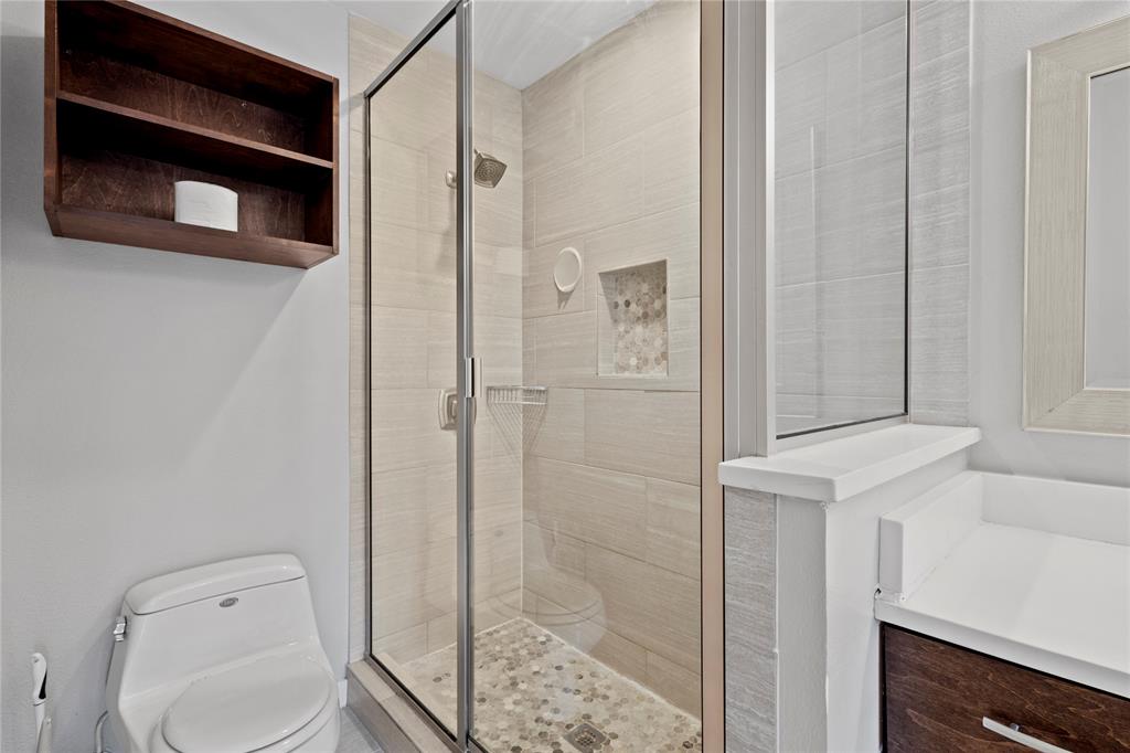 4371 Madera Road, Unit 4 Irving, TX 75038 - Photo 7 of 23 Bathroom with walk in shower, large vanity, and toilet