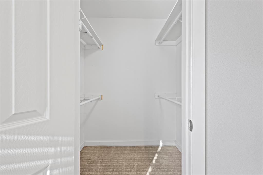 4371 Madera Road, Unit 4 Irving, TX 75038 - Photo 8 of 23 Walk in closet featuring carpet flooring