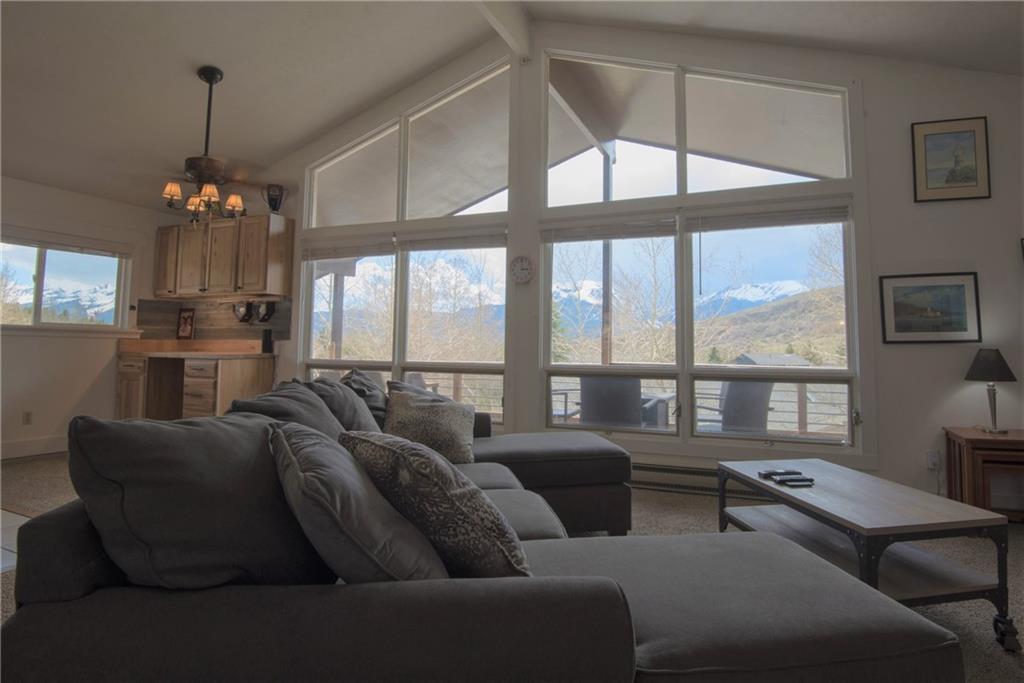 423 Big Elk Road Dillon, CO 80435 - Photo 1 of 35 a living room with furniture and a chandelier