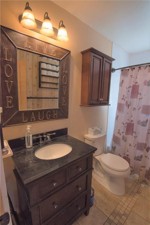 423 Big Elk Road Dillon, CO 80435 - Photo 12 of 35 a bathroom with a granite countertop toilet sink and mirror